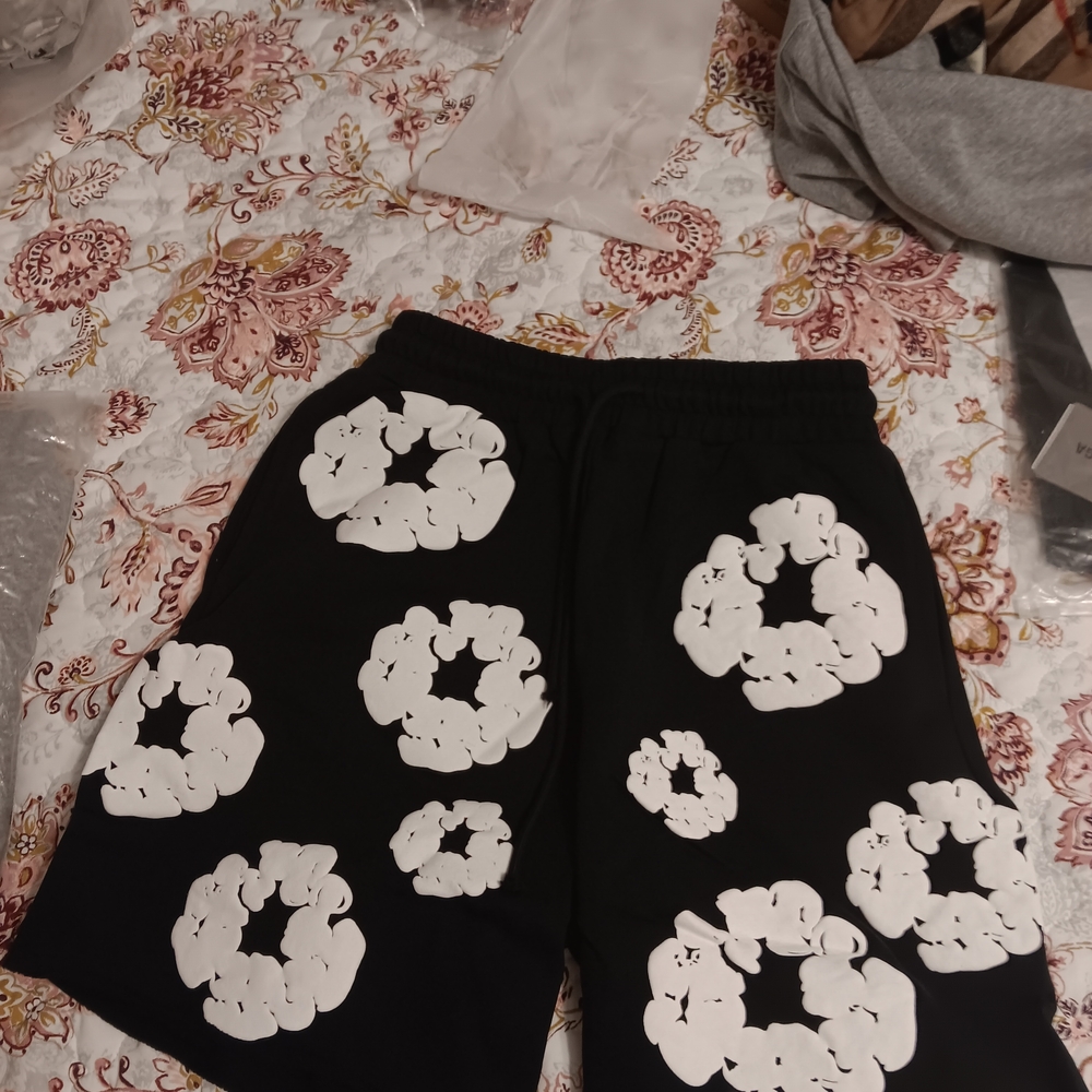 Denim Tears Black Shorts with White Floral Design
